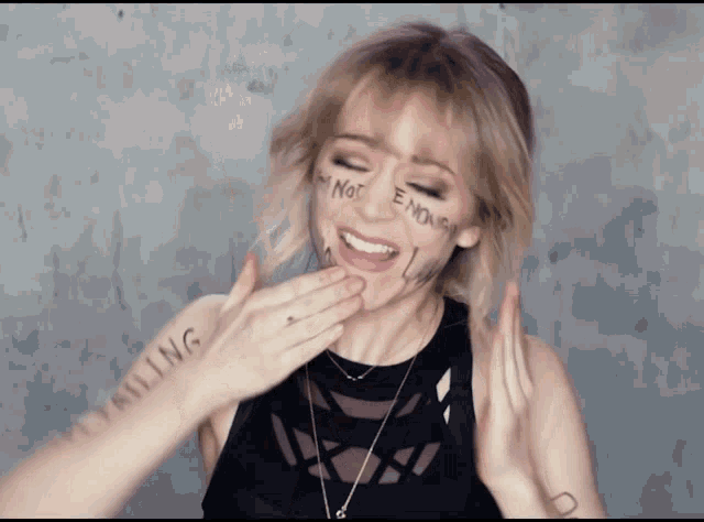 Lindsey Stirling Cleaning GIF - Lindsey Stirling Cleaning Face GIFs