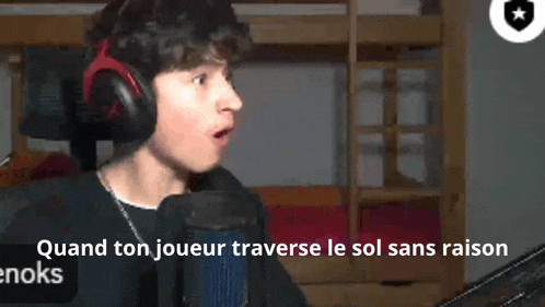 a man wearing headphones is talking into a microphone