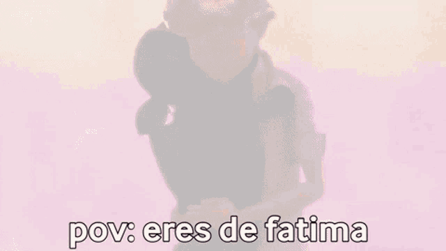 a boy is hugging a black cat with the words `` pov : eres de fatima '' written on the bottom .