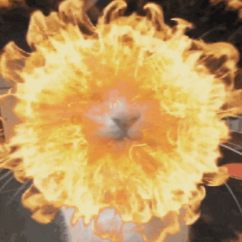 a close up of a large explosion of fire