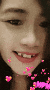 a close up of a woman 's face with hearts and the word npn