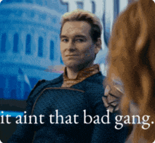 a man is talking to a woman with the words " it aint that bad gang "