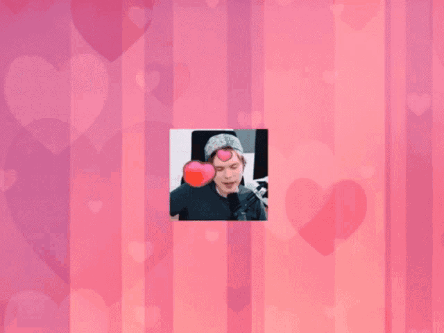 a man wearing a bandana is surrounded by hearts on a pink background