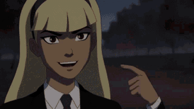 a girl in a suit and tie holding a red object