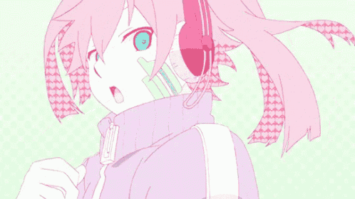 a girl with pink hair is wearing headphones and a sweater