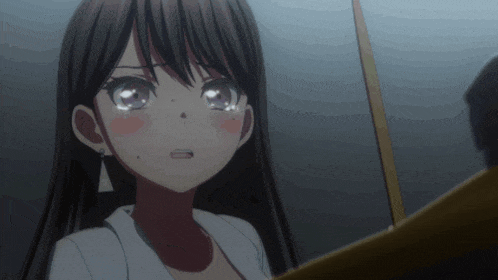 a close up of a girl 's face with tears running down her cheeks