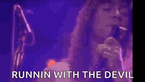 a woman with purple smoke coming out of her mouth with the words runnin with the devil written below her