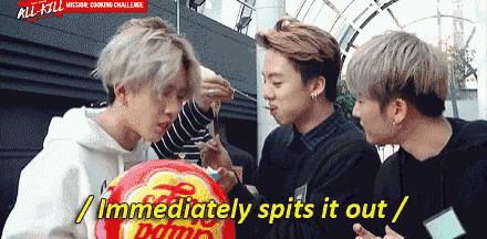 a group of young men are eating a chupa chups candy and one of them says " immediately spits it out "