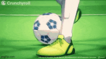 a soccer player is kicking a soccer ball on a field .