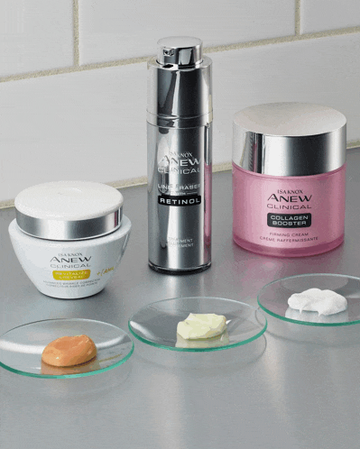 a bottle of anew clinical line eraser retinol sits next to two other bottles