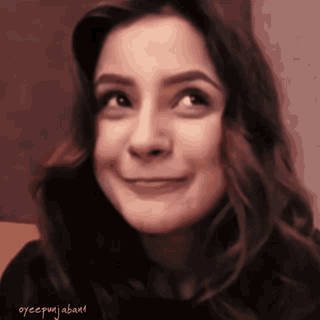 a close up of a woman 's face with the name oyccpunjabiaband written below it