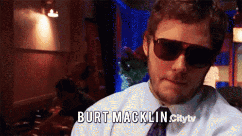 a man wearing sunglasses with burt macklin citytv written on the bottom