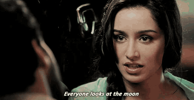a woman says everyone looks at the moon to a man
