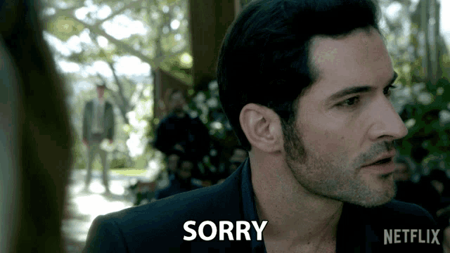 a man in a suit says sorry in a netflix ad