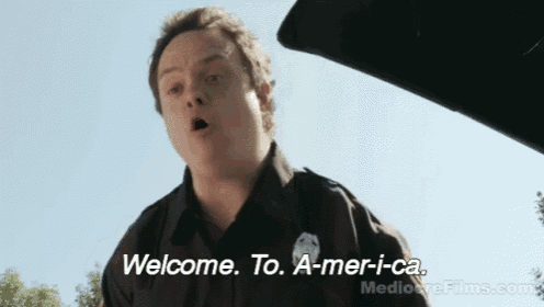 a man says welcome to a-mer-i-ca on a screen