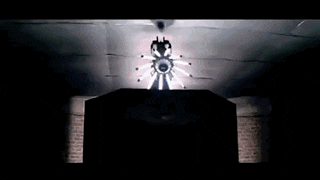 a woman is dancing in a dark room with a lot of lights