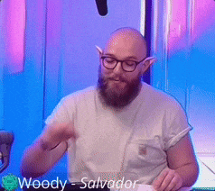 a bald man with a beard and glasses is named woody - salvador