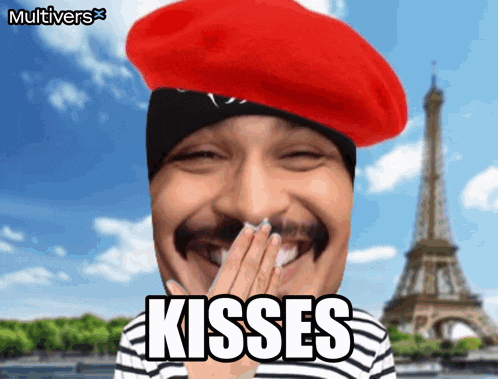 a man wearing a red beret with the word kisses written on it