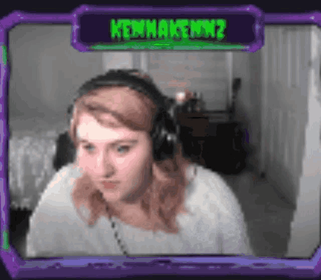 a woman wearing headphones is sitting in front of a screen that says " kenmakenmz "