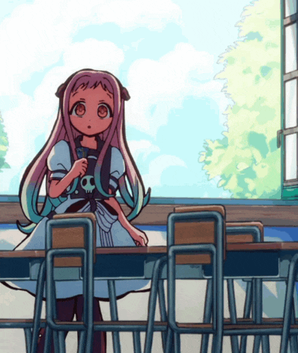 a girl in a blue dress with a skull on her chest sits at a desk in front of a window