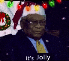 a man in a suit and tie is wearing a santa hat and a wreath .