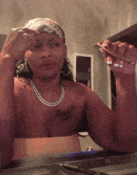 a woman with a tattoo on her chest that says ' angel '
