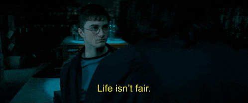 a man talking to another man with the words life isn 't fair on the bottom