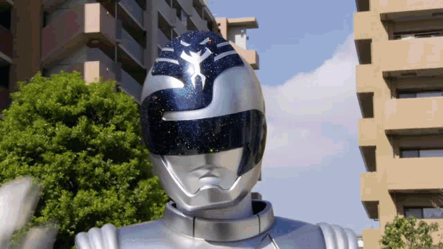 a silver ranger with a blue helmet and a star on it