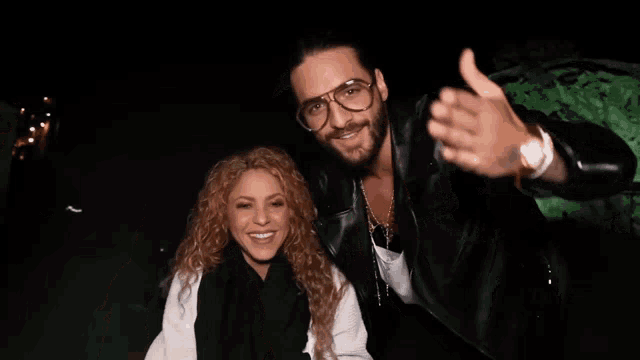 a man and a woman are standing next to each other with the words shakibaby < 3 written above them