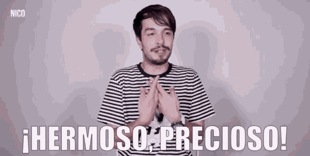 a man in a striped shirt says " hermoso precioso " in spanish