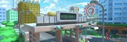 a highway sign in a city with a ferris wheel