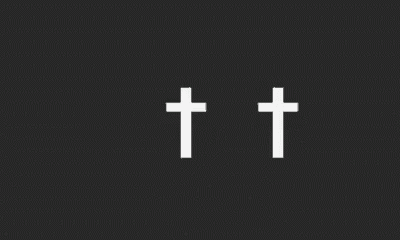 three white crosses on a black background