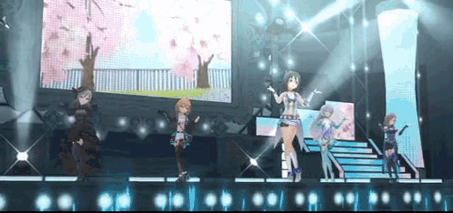 a group of anime girls are standing on a stage .