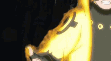 a close up of a person 's arm with a yellow fire coming out of it and a black background .
