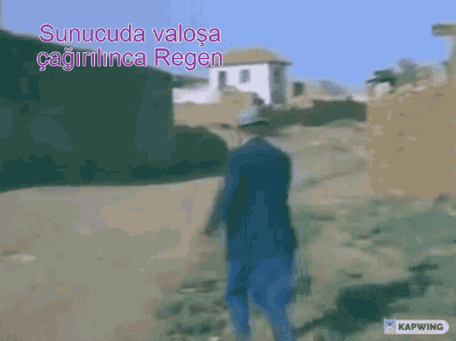 a man in a blue suit is walking down a dirt road with the words " sunucuda valosa " written above him