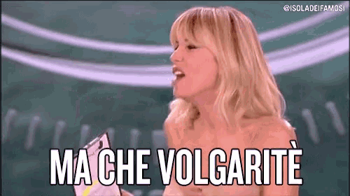 a woman without a shirt is holding a piece of paper and says ma che volgarite