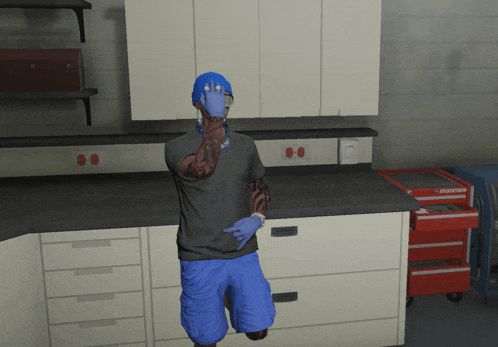 a man wearing a blue hat and blue shorts is standing in a kitchen with a craftsman toolbox in the background