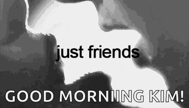 a black and white photo of a man and woman kissing with the words `` just friends '' .