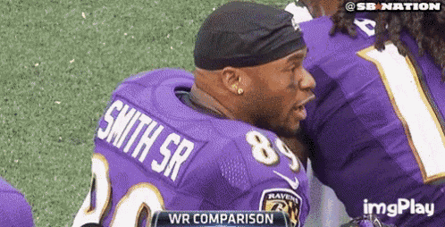 a football player with the name smith sr on his back