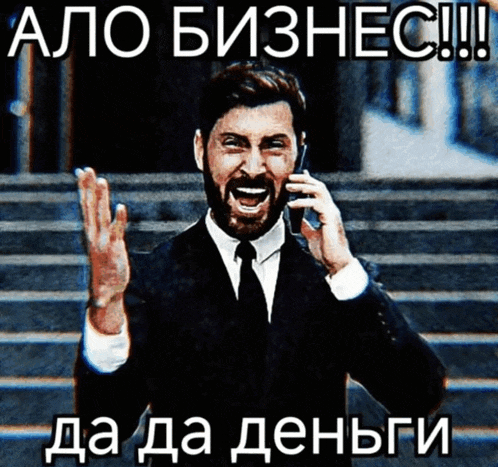 a man in a suit and tie is talking on a cell phone in a foreign language