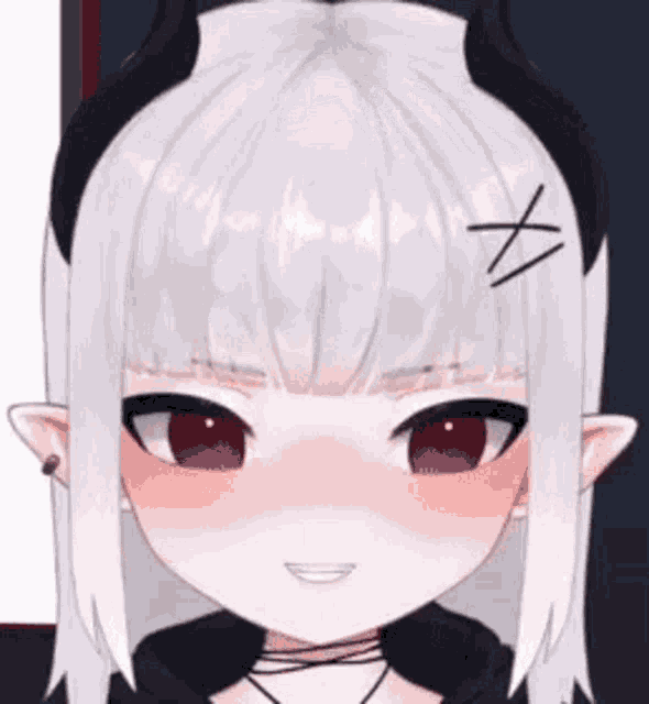 a close up of a girl with white hair and red eyes wearing a headband with horns .
