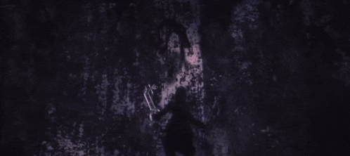a person is holding a key in a heart shape