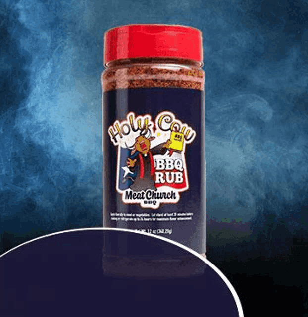 a bottle of holy cow bbq rub on a purple background