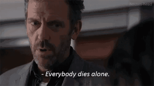 a man in a suit says " everybody dies alone " in front of a woman