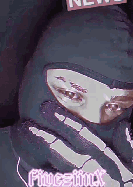 a person wearing a skeleton mask with the word fivejinx on the bottom left