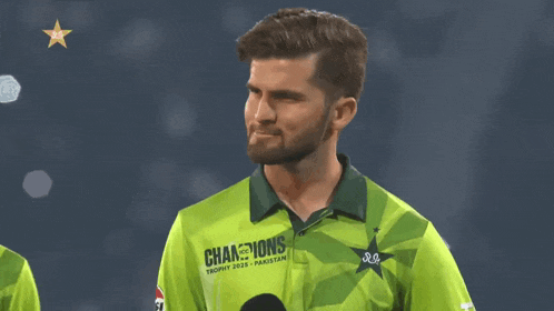 a man in a green shirt that says ' champions trophy 2020 ' on it