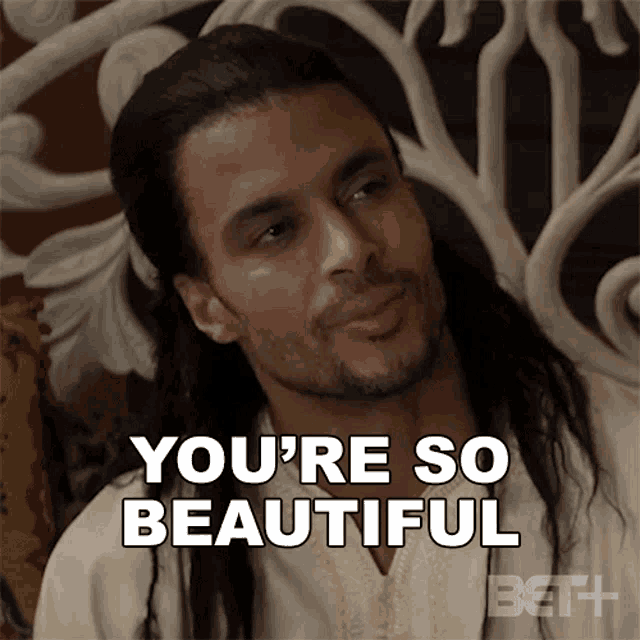 a man with long hair and a beard is saying you 're so beautiful