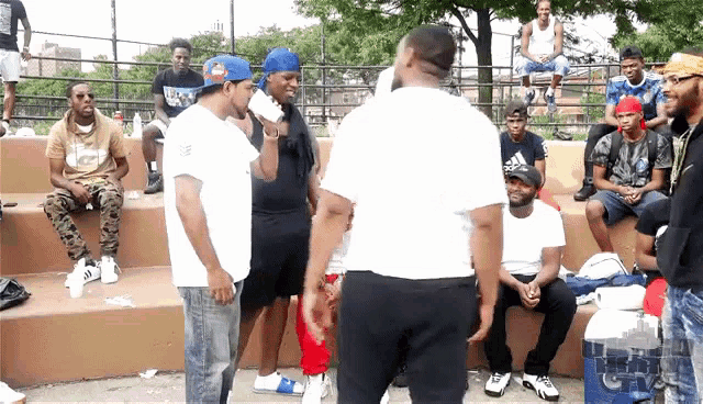 a man in a white shirt with the word adidas on it