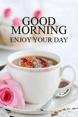 a cup of coffee and a pink rose on a saucer with the words `` good morning enjoy your day '' written on it .