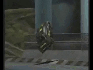 a bottle of monster energy drink is flying through the air in a room .